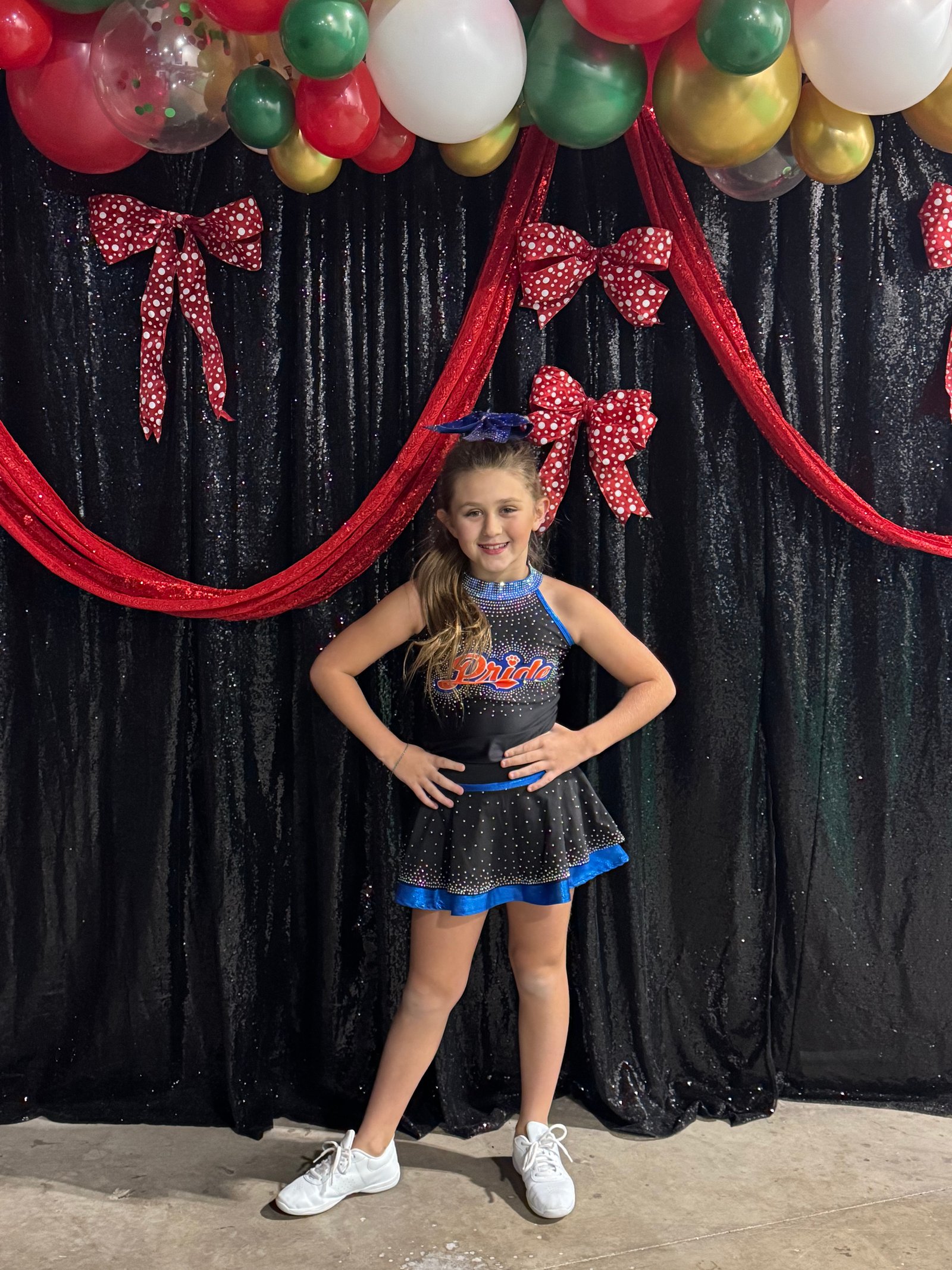 Youth cheerleader in competition uniform